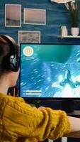 Professional esports gamer playing shooter mock-up game with new graphics and lots of actions. Pro esport team player streamer playing gaming tournament on powerful RGB computer, using modern streaming technology photo