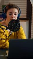 Vlogger on air during online show using laptop, reading emails. Creative online show On-air production internet broadcast host streaming live content, recording digital social media communication photo