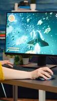 Professional esport woman gamer compete in a game playing on a championship event. Online streaming cyber performing on powerful personal computer in stylish room during gaming tournament photo