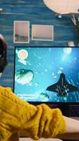 Expert woman gamer playing space shooter game on powerful PC. Virtual shooter game championship in cyberspace, esports player performing on computer in stylish room during gaming tournament photo