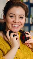 Professional esport woman gamer smiling at camera while compete in game playing on a championship event. Online streaming cyber performing on powerful personal computer during gaming tournament photo