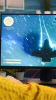 Gamer trying to relax playing space shooter online videogame on powerful pc spending loisure time at home. Virtual shooter game in cyberspace, esports player performing on pc gaming tournament photo