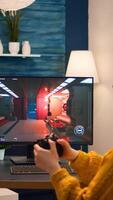 Woman esport cyber playing online game with virtual reality headset and wireless controller. Virtual shooter game championship in cyberspace, esports player performing on pc during gaming tournament photo