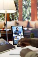Entrepreneur presenting development strategies and funding plans to shareholders on remote conference call, using data reports to ensure economic development. Businessman discussing with investors. photo