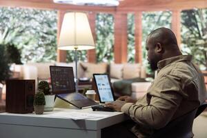 AI software engineer coding a modern innovative development project on his laptop, showcasing machine learning and data processing on neural network. Artificial intelligence digital business. photo