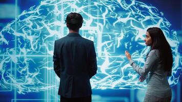 Engineers use VR headset and AR hologram, looking at AI neural networks modeled after human brain. Admins using artificial intelligence, virtual and augmented reality tech to look at data, camera B photo