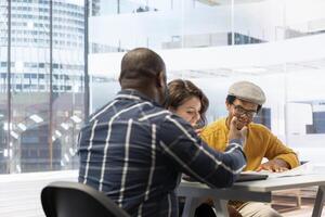 Realtor and clients exploring an urban property financial potential, evaluating architectural blueprints and negotiating leasing contract terms for a high class corporate office space. photo