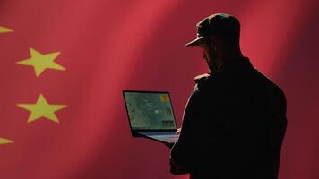 Chinese soldier using radar detecting ballistic missile attacks and conducting general space surveillance and satellite tracking. CCP agent using military laptop software preventing rockets, camera A photo