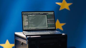 European Union intelligence agency using laptop to protect against mass propaganda tools affecting elections. EU security service engaging in psychological operations using device, camera A photo