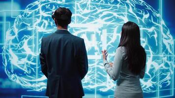 Engineer wearing VR headset looking at hologram of artificial intelligence human brain simulation, assisted by colleague. IT specialist and coworker interacting with AI visualization, camera B photo