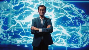 Upbeat engineer in startup doing advancements in AI field. Portrait of happy man standing with arms crossed in front of cutting edge display featuring AI and neural network graphics, camera B photo