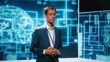 Smiling public speaker hosting AI convention gathering tech startups managers and academics. IT expert moderating symposium, teaching industry workers how to tap into artificial intelligence, camera A photo