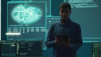 Cyber intelligence team defending against cyber threats and espionage. Governmental hacker using advanced technology to access information and secure networks, monitors high tech facility. Camera A. photo