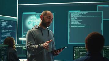 Governmental cyber defense team using advanced technology to secure information, cyber operations in high tech monitoring center. Working on data protection and threat detection. Camera A. photo