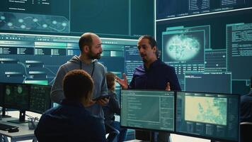 Governmental cyber defense team using advanced technology to secure information, cyber operations in high tech monitoring center. Working on data protection and threat detection. Camera B. photo