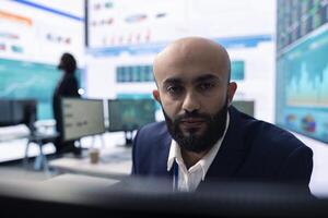 Accounting manager reviewing budget numbers after monthly costs, working on a financial projection to deduct the future enterprise situation. Business analyst does a financial study. photo