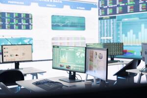 Multinational company headquarters office with a big data screen, technology used for employees to monitor numbers and infographics relevant to business development or expansion. photo