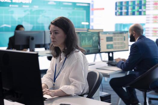 Project manager examining key performance metrics to ensure global business success, working with annual infographics to understand what needs improving. Multinational company activities. photo