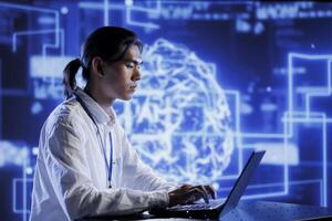 Trained technician in data center uses artificial intelligence computing simulating human brain through self learning algorithms. Knowledgeable expert with laptop working with AI deep neural networks photo