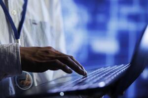 Trained developer writes code on laptop to visualize artificial intelligence neural networks using augmented reality, close up. Server farm specialist runs AI script for information processing photo