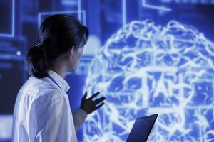 Trained programmer using laptop to maintenance artificial intelligence neural networks simulating human thought processes in computerized model. Experienced specialist doing checkup on AI systems photo