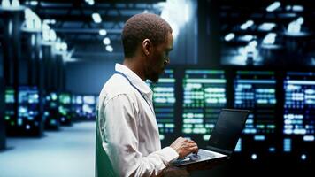 Supervisor monitoring crypto mining supercomputers solving complex mathematical equations. Admin in server farm hosting blockchain technology high volume real time transactions photo