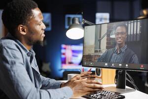Recruitment consultant addressing inquiries during live interview, meeting with candidate over online teleworking videocall. Manager having conversation with african american applicant. photo