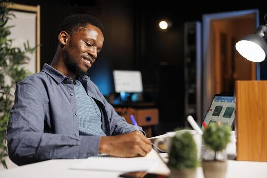 African american expert evaluating legal economy balance on laptop, professional accountant checking capital funds development plan. Entrepreneur analyzing financial statistics. photo