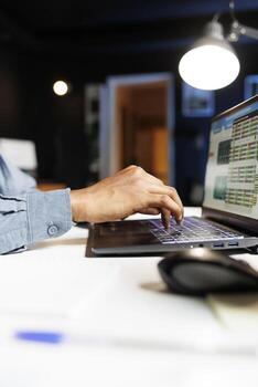 Economic consultant studying company expenses and income, creating a legal balance between cost and revenue parts to help with funding growth. Expert reviews online banking reports. Close up. photo