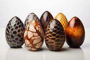 A group of colorful easter eggs sitting next to each other in a neat row. photo