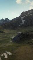 An aerial view of a mountain range with snow on it video