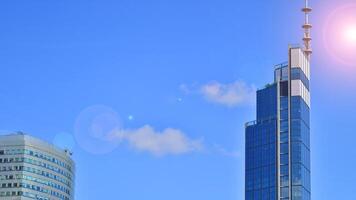 European modern office architecture. View of modern skyscrapers in business district against blue sky. Looking up at business buildings in downtown. photo