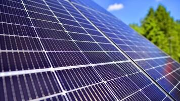Group of solar panels on a blue sky. Concept of solar energy. photo