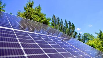 Group of solar panels on a blue sky. Concept of solar energy. photo