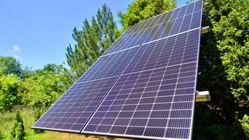 Solar power station generating clean energy. Solar panels in the nature. photo