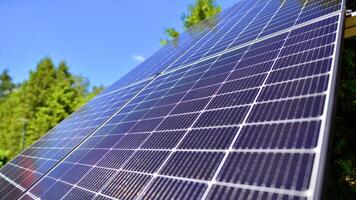 Group of solar panels on a blue sky. Concept of solar energy. photo