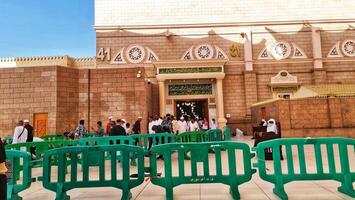 Medina, Saudi Arabia on March 1, 2024. Queues of female Umrah pilgrims from all over the world line up to enter Raudhah or the Tomb of the Prophet Muhammad. Gate 37. Use a registered Tasreh or Nusuk. photo