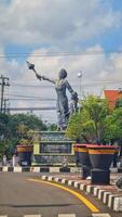 Jepara, Indonesia on January 21, 2024. A crossroads in Jepara where in the middle there is a statue of Our Lady Kartini. photo