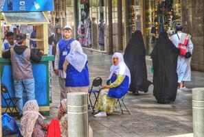 Medina, Saudi Arabia on March 3 2024. Female Umrah pilgrims are buying internet data packages at the Mobily counter, so they can stay connected with their families in their hometowns. GIGABYTES. photo