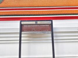 Bangkok, Thailand on July 22 2023. Information board regarding the opening hours of Wat Phra Chettuphon Wimon Mangkhlaram Ratchaworamahawihan photo