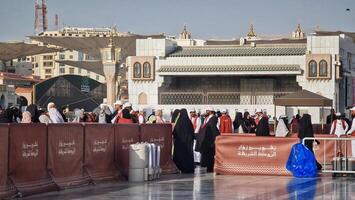 Medina, Saudi Arabia on March 1, 2024. Queues of female Umrah pilgrims from all over the world line up to enter Raudhah photo