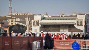 Medina, Saudi Arabia on March 1, 2024. Queues of female Umrah pilgrims from all over the world line up to enter Raudhah photo