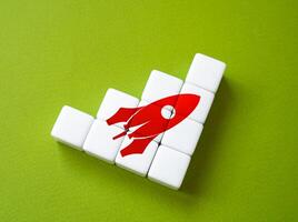 Rocket and steps of progress. Startup concept. Raising funds and searching for financing. Roadmap, work stages, action plan. Search for investments for the project. Space race photo