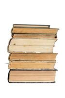 bottom view of a book stack - page edges of an old closed hardcover books stacked, isolated on white with clipping path photo