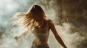 Dynamic photo of a woman dancing with flowing hair in a dark, smoky environment, capturing motion and energy.