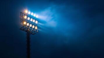 Photo of A stadium light on an empty dark blue background