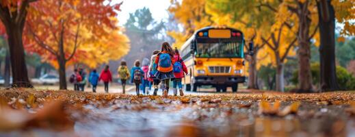 Group of excited school children with backpacks, autumn trees splashing gold and red, blurred school bus in the distance, wide-angle perspective, capturing the essence of a new school year photo