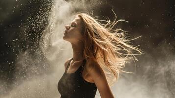 Slender blonde dancing in white dust studio shot photo