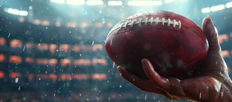 Close-up of a hand holding an American football under stadium lights, captured during a sporting event with dramatic lighting and action. photo