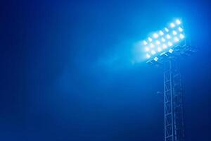 Bright stadium floodlights illuminating the night sky, perfect for sports events and outdoor activities captured in high resolution. photo